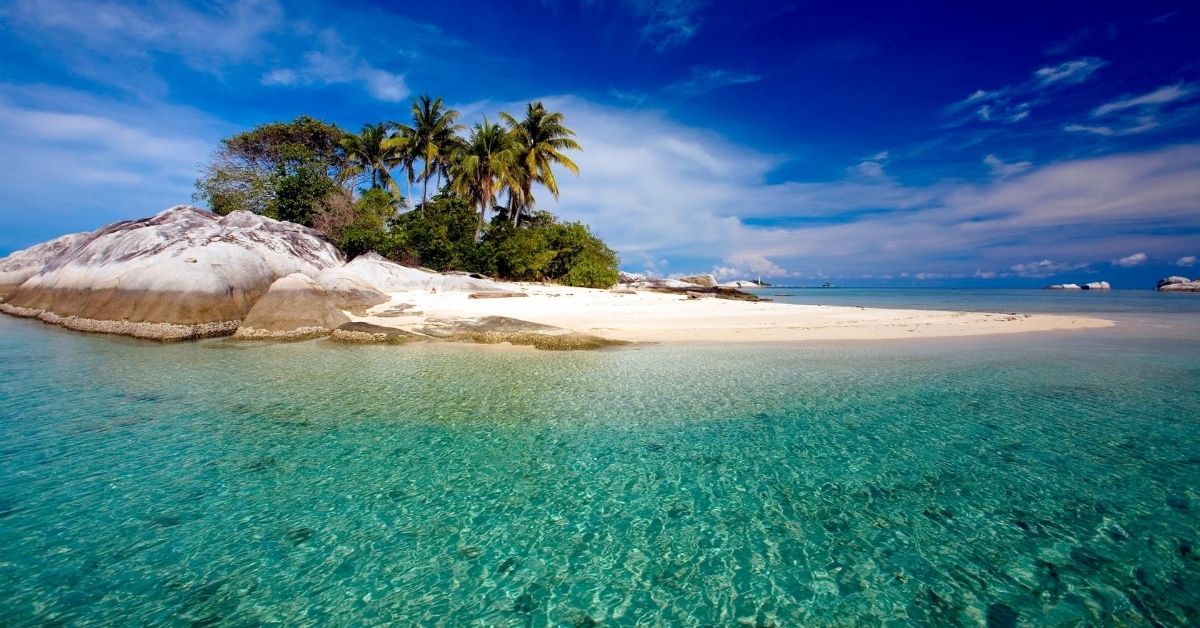 tiny rock island and beach in the Java sea