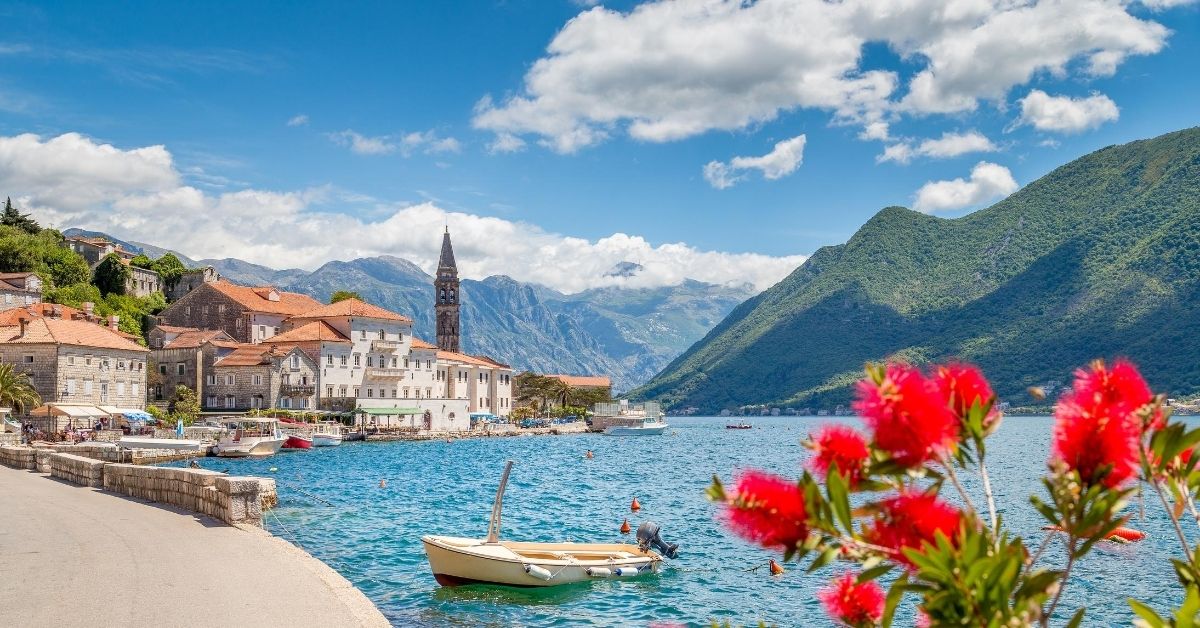 lovely day in Persast along the shores of the bay with mountains and town