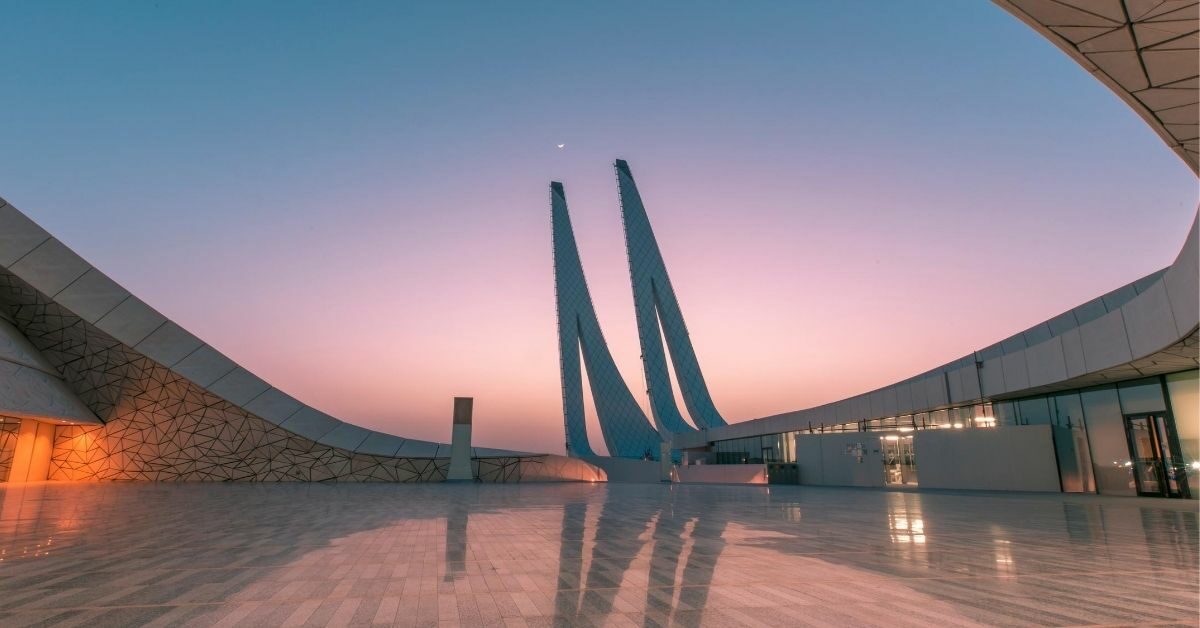 modern mosque architecture with curved lines in Doha at sunset with reflections in marble