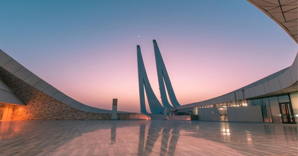 modern mosque architecture with curved lines in Doha at sunset with reflections in marble