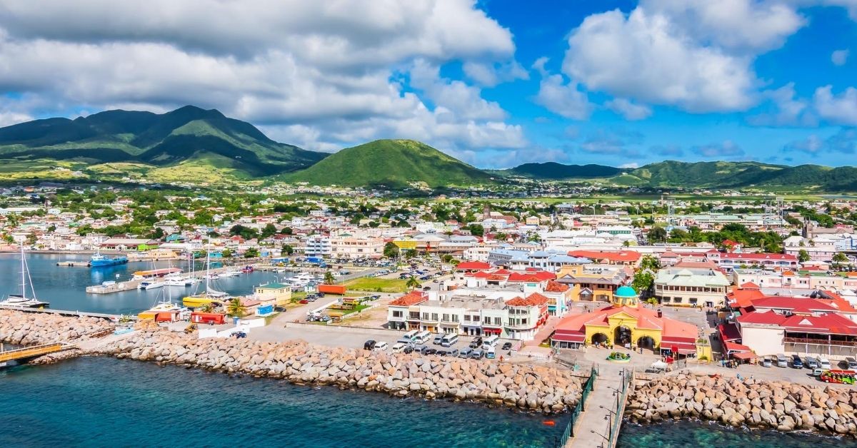 colorful building and green mountains on Saint Kitts