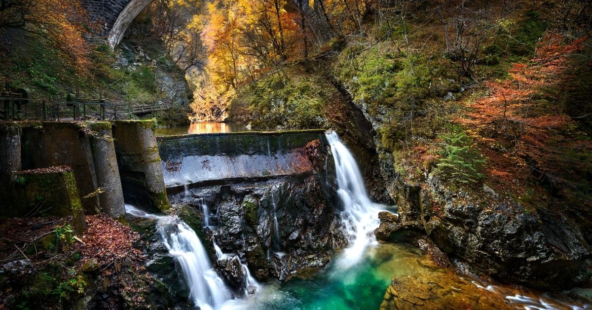 waterfall in the forest falling into a beautiful blue pool