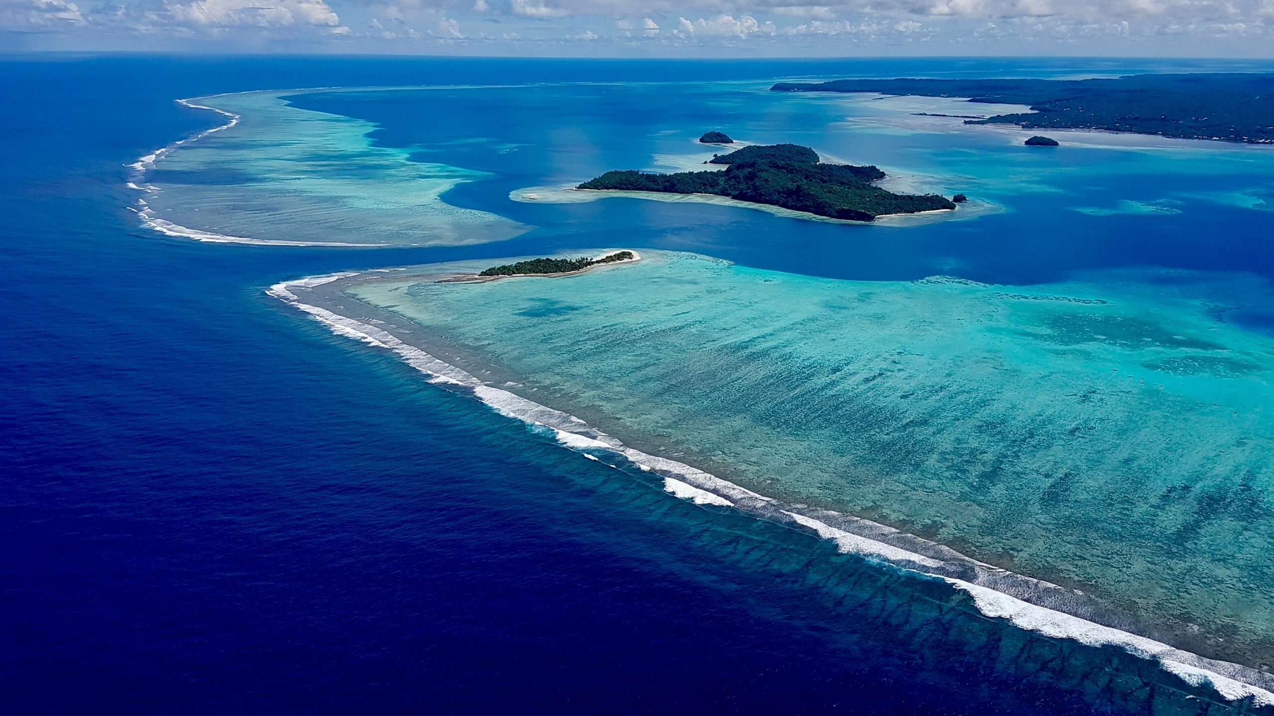 bird's eye view of beautiful blue and turquoise waters and islands of Wallis & Futuna