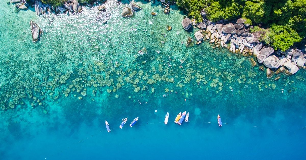 bird's eye view of sea and boats with coast in Malaysia