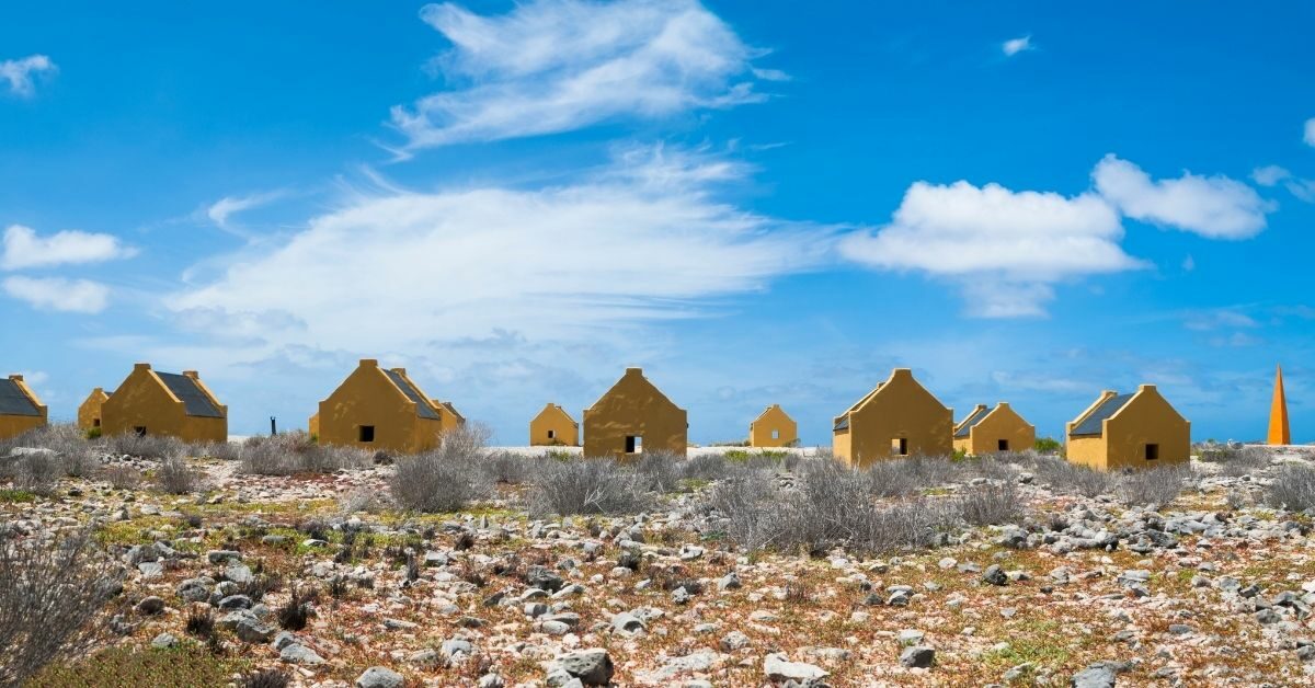 yellow slave huts on the beach in Bonaire