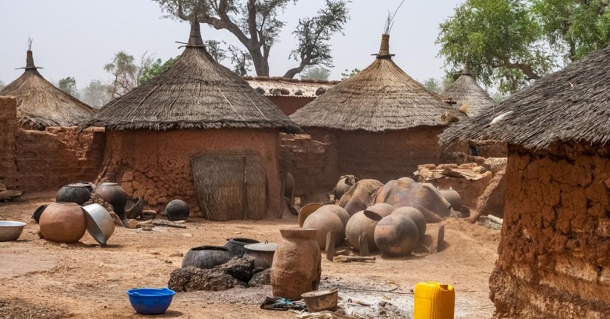 group of traditional mud brick huts in an African village of Burkina Faso