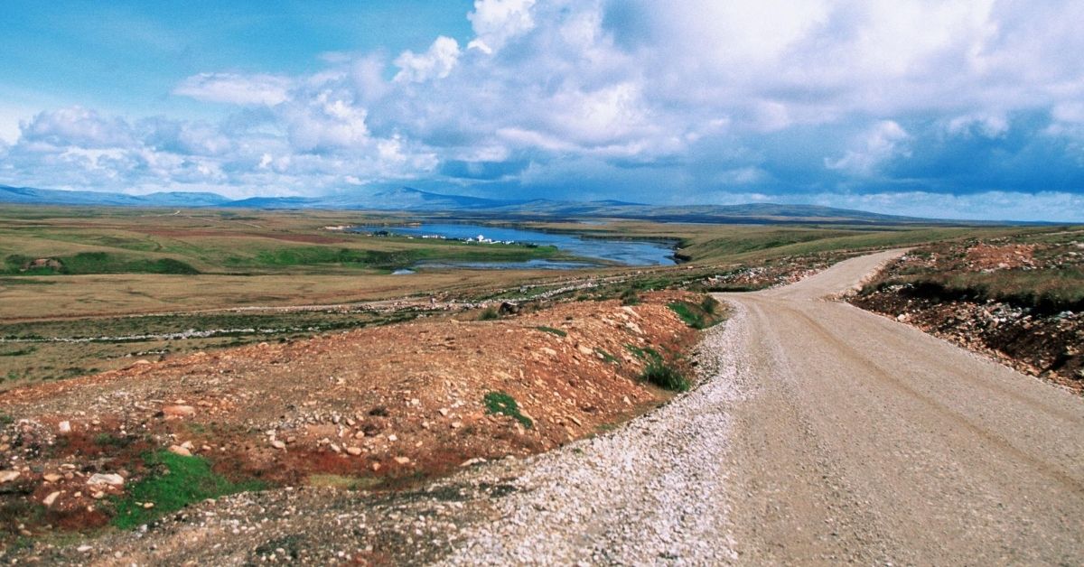 dirt road meandering through landscape of Falkland Islands