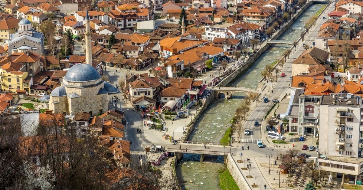 bird's eye view of Prizen, Kosovo with canal, bridges and buildings