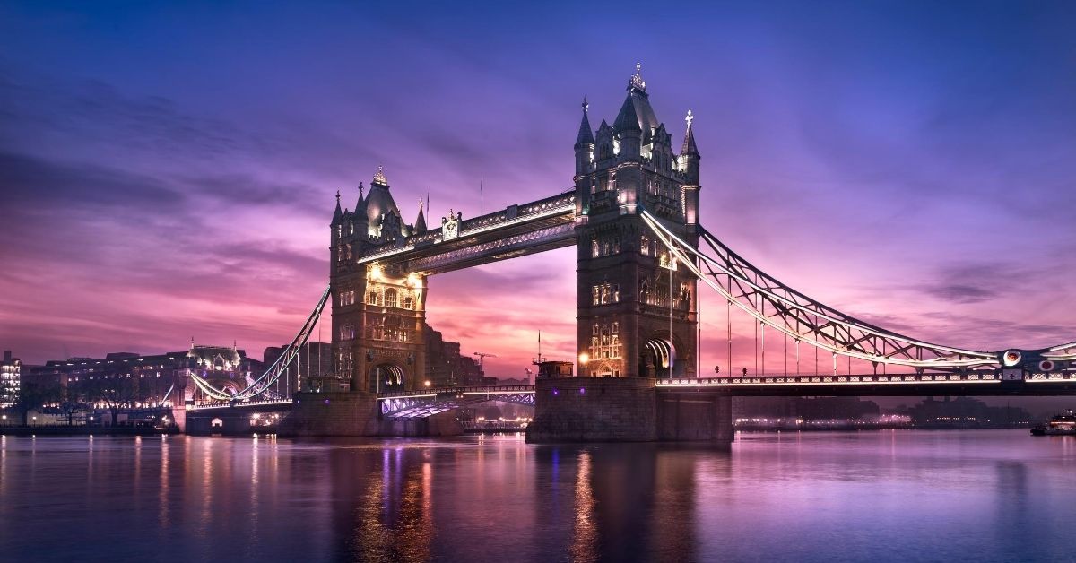 London bridge at dusk with purple and pink skies