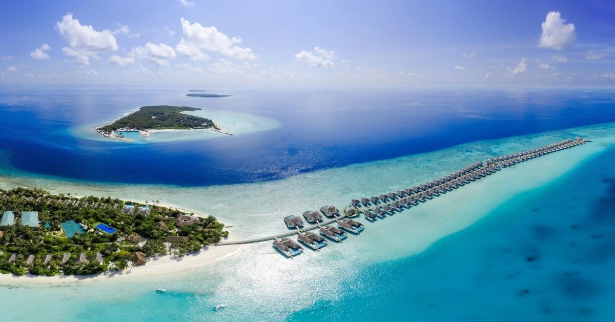 aerial view of islands in the maldives with sandbars and resorts