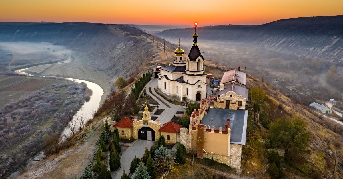 historical monastery in atop a mountain in Moldova at sunrise