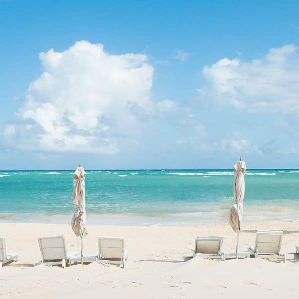 Perfect white sand beach with loungers and umbrellas in Punta Cana, Dominican Republic