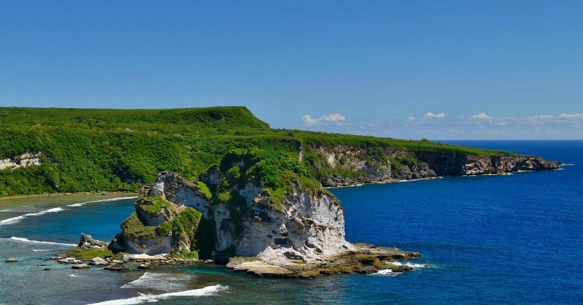 island of Saipan with rocky formation protruding from the Pacific