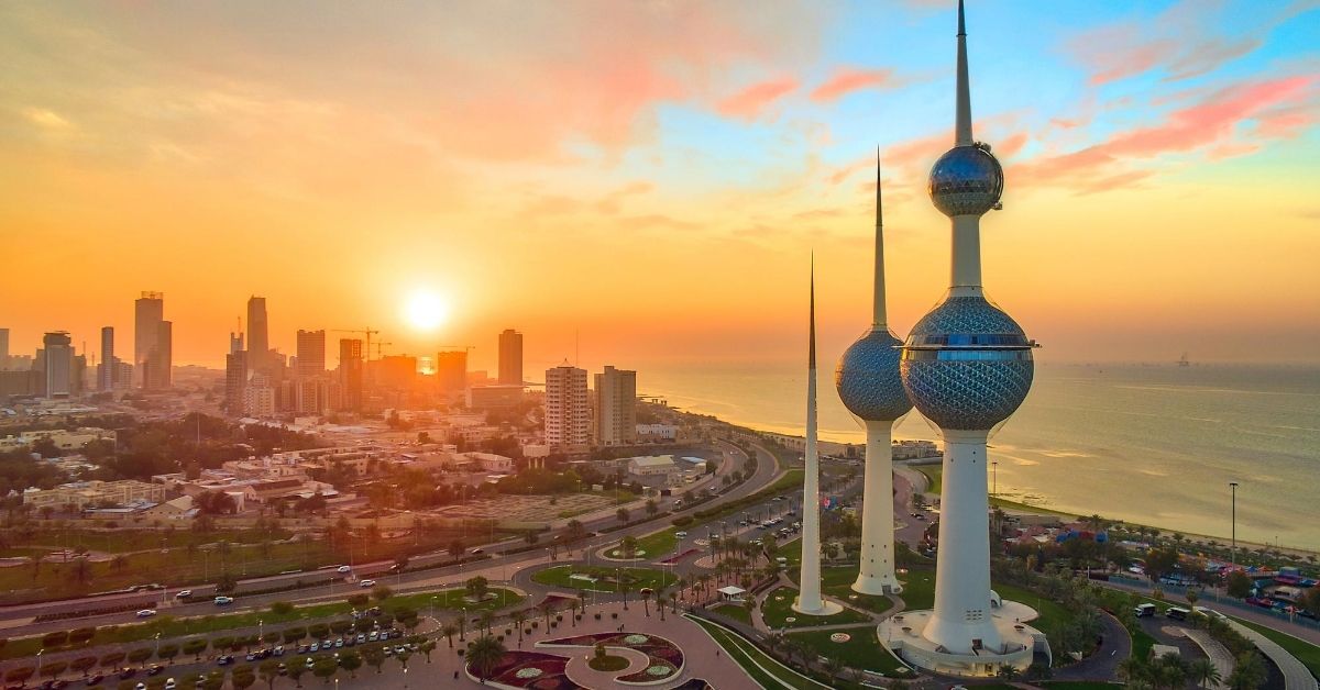 skyline of Kuwait City and the Persian Gulf at sunset with pastel skies