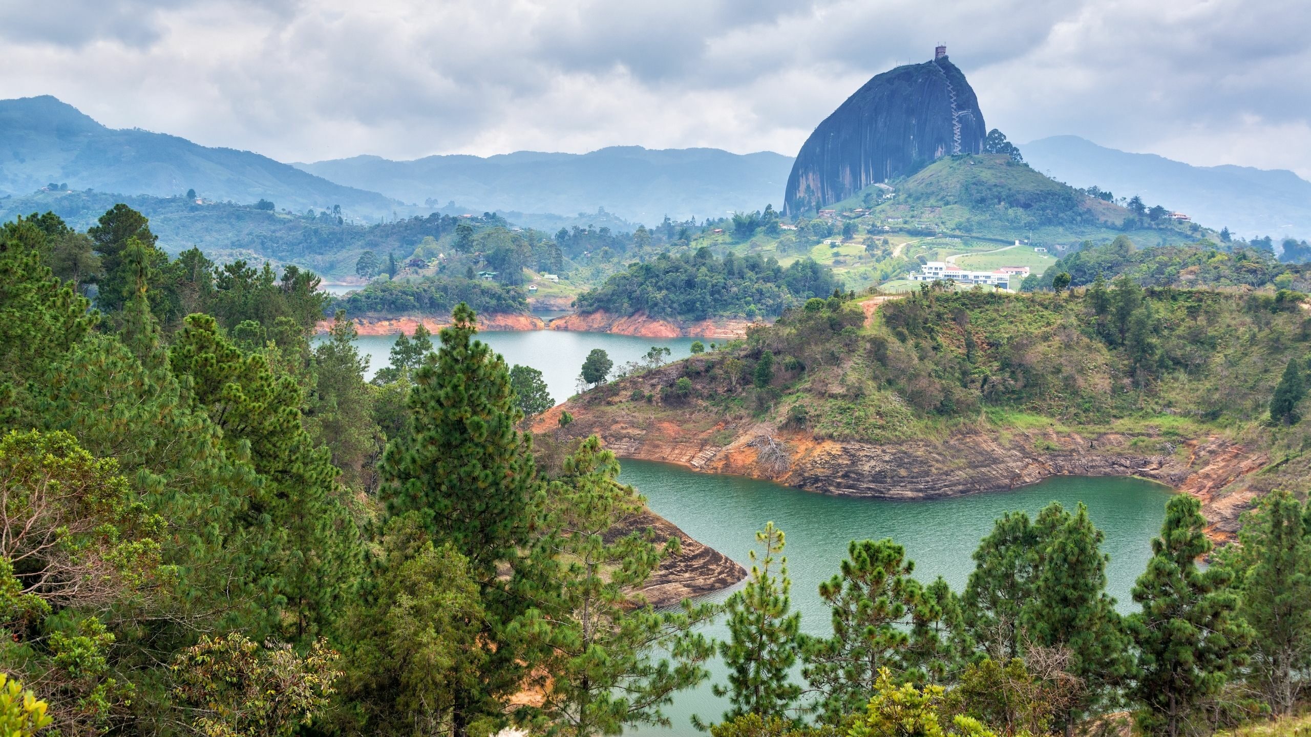 landscape with a rock mountain in Guatape Colombia with river