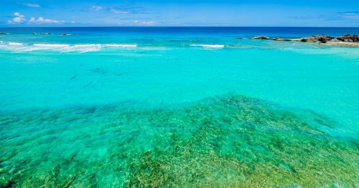 Beautiful Caribbean in shades of aquamarine water with coral