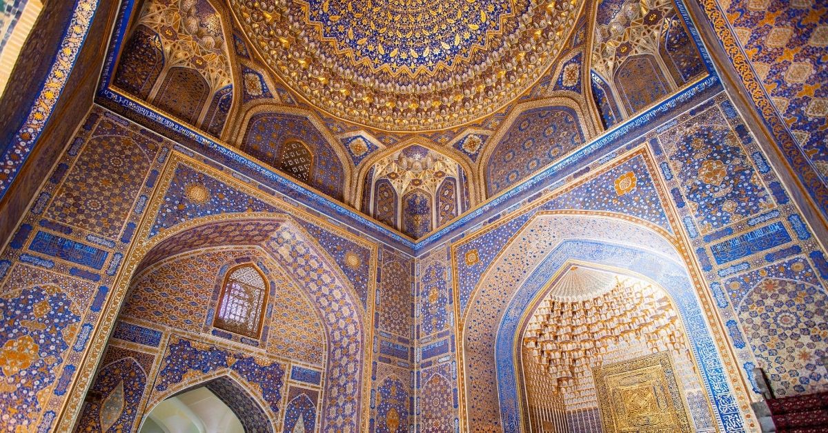 mosque with ornate gold, blue and white mosaic covering the entire structure